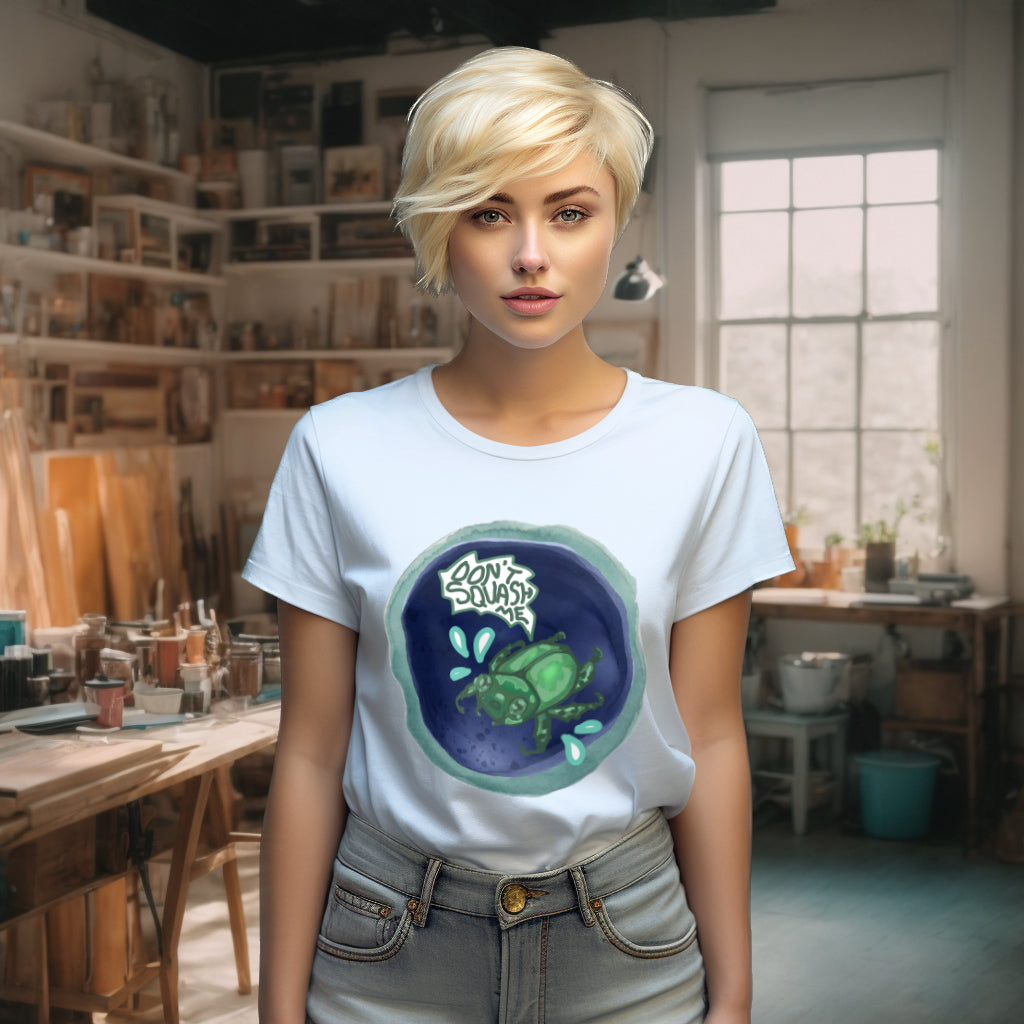 The delicate Serene Blue 'Don't Squash Me' T-Shirt, worn by a model, highlights the scared beetle in watercolor, offering a soft contrast to the whimsical art, perfect for subtle yet meaningful fashion statements.