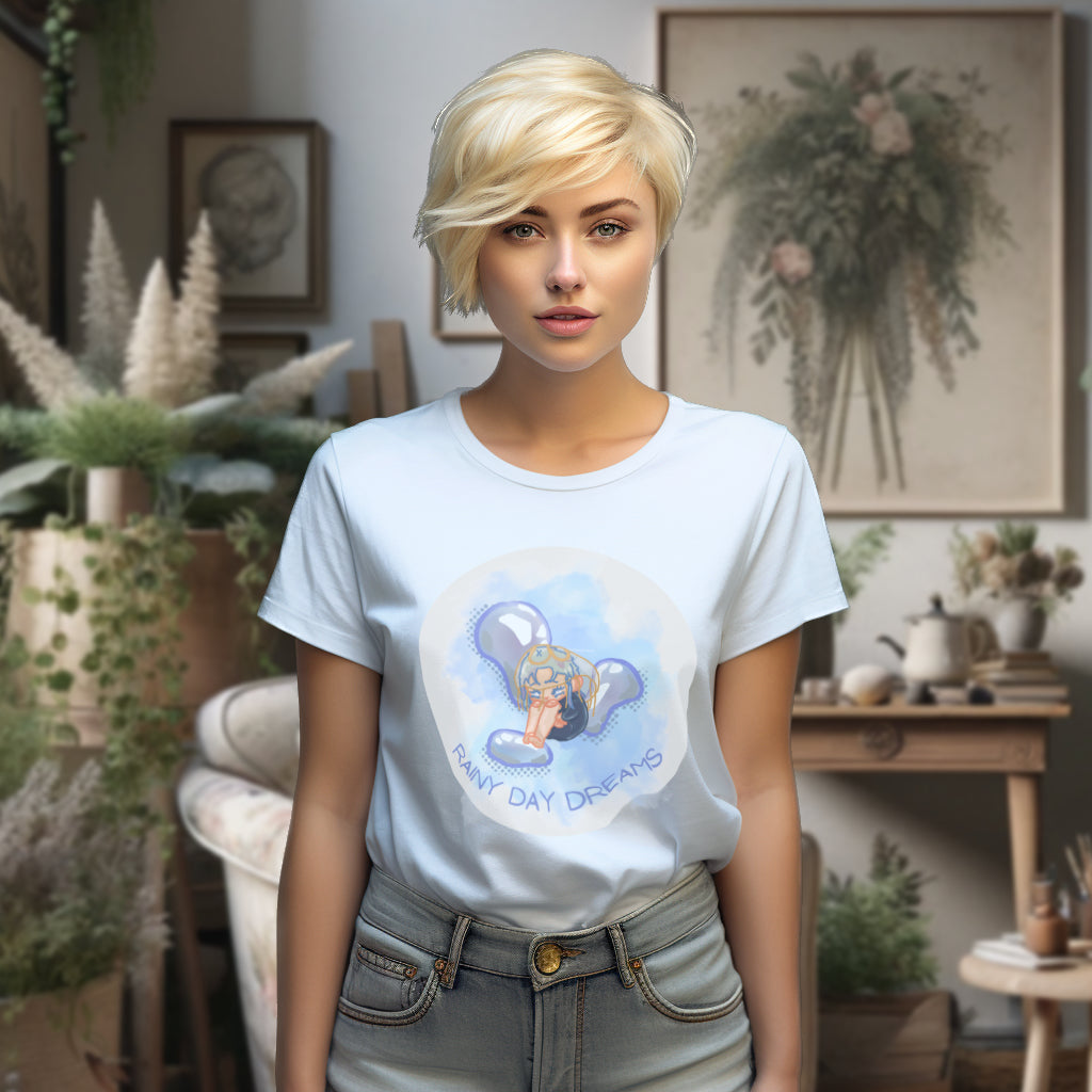 On a model, the 'Rainy Day Dreams' T-Shirt in tranquil Serene Blue features a contemplative chibi character, blending the calmness of the hue with the depth of introspective rainy moments.
