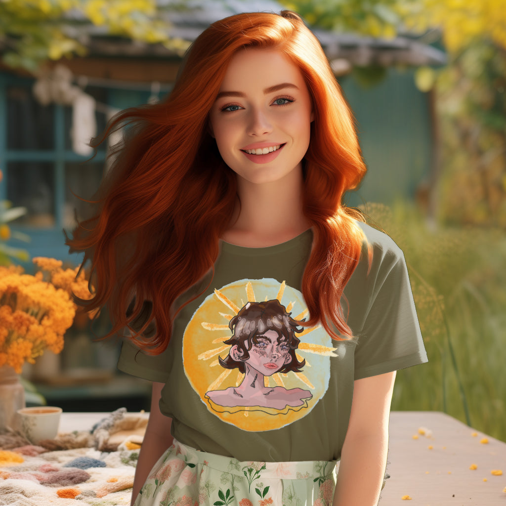 On a model, the 'Sunshine Girl' T-Shirt in khaki features a unique blend of traditional Art Deco grace and expressive, glitchy artistry, evoking a sense of depth and reflection.
