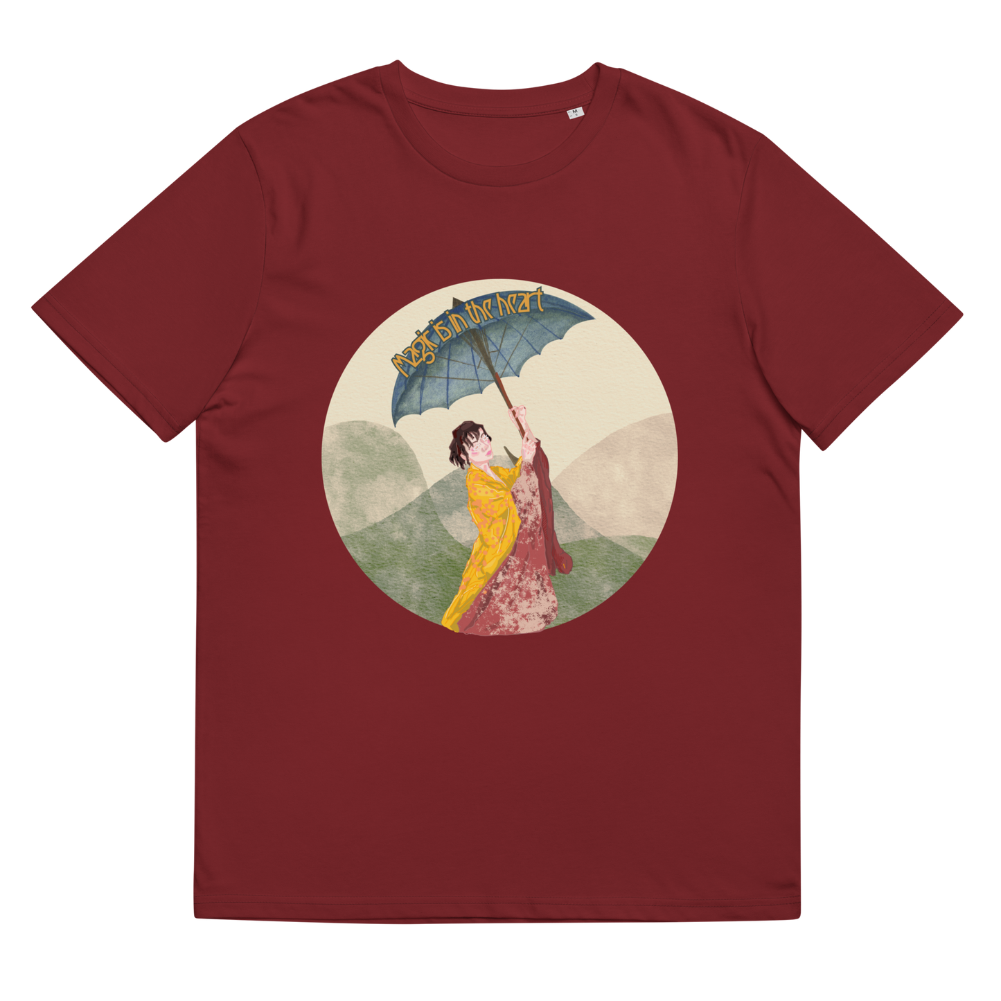 Close-up of the 'Magic is in the Heart' T-Shirt in Burgundy, laid flat to feature the detailed artwork of the kimono-clad woman and parasol, a testament to beauty, tradition, and inner strength.