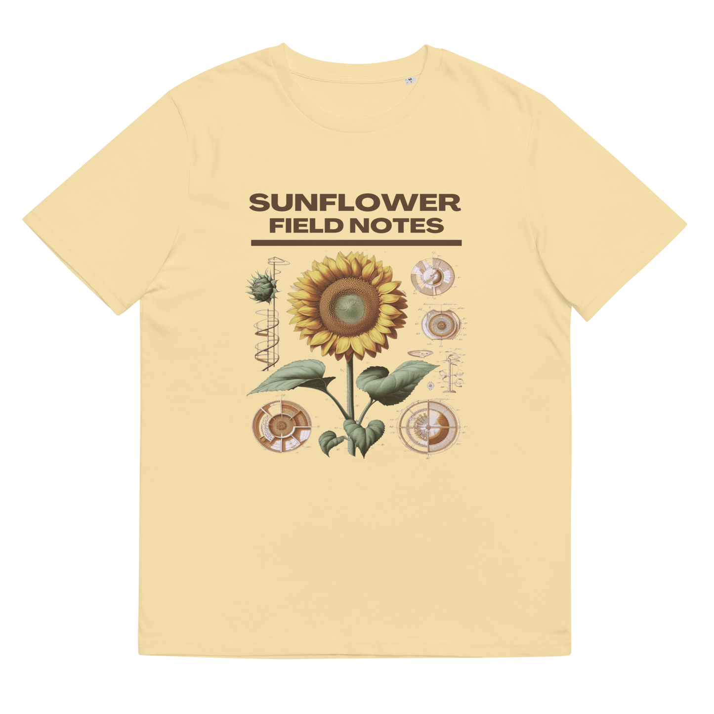 Lay-flat view of the 'Sunflower Field Notes' Tee Shirt in butter, emphasizing the meticulous sunflower illustration, a wearable piece of art for those who admire the wonders of the natural world.