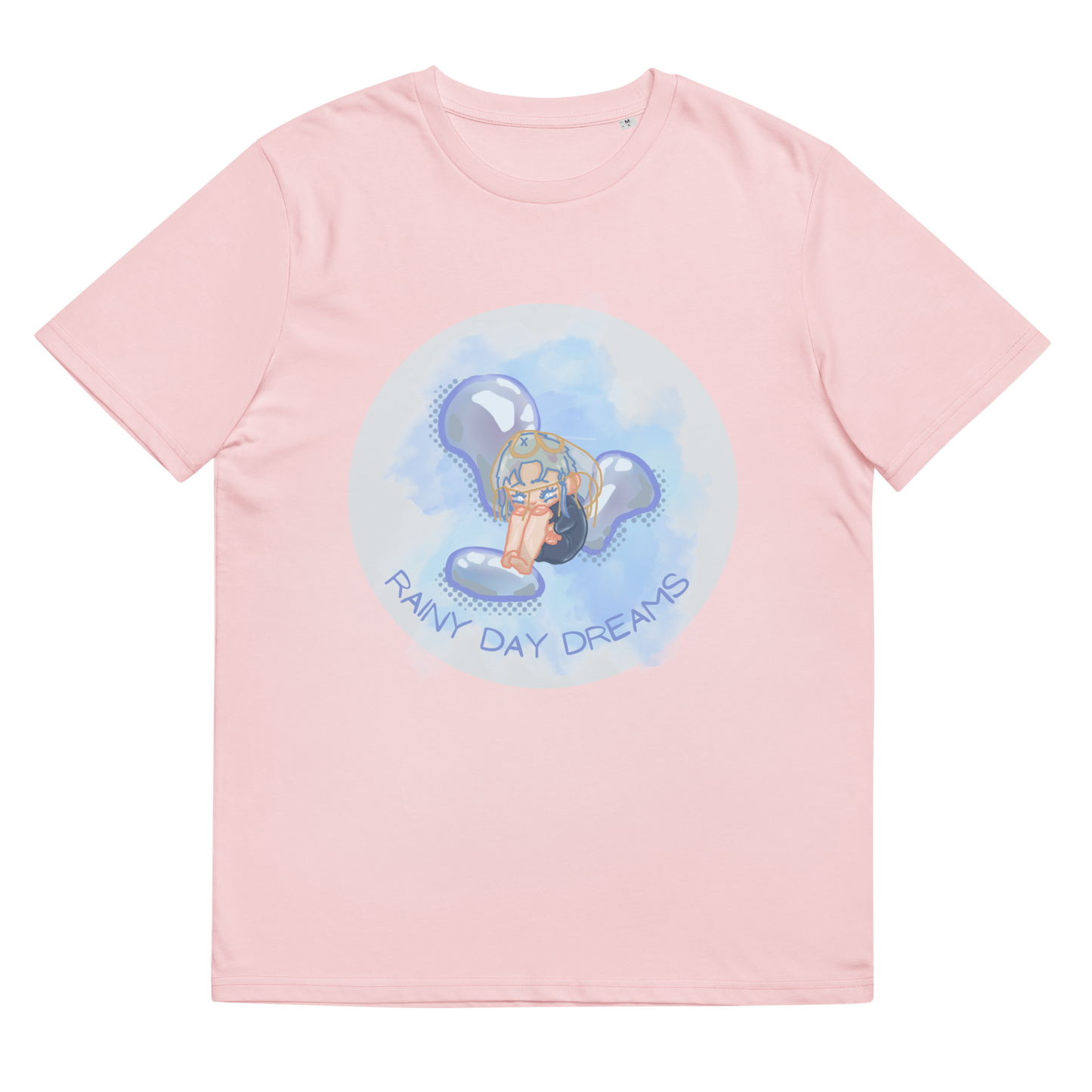 Close-up of the 'Rainy Day Dreams' T-Shirt in Cotton Pink, laid flat to feature the emotive chibi character design, merging the softness of the color with the depth of rainy day reflections.