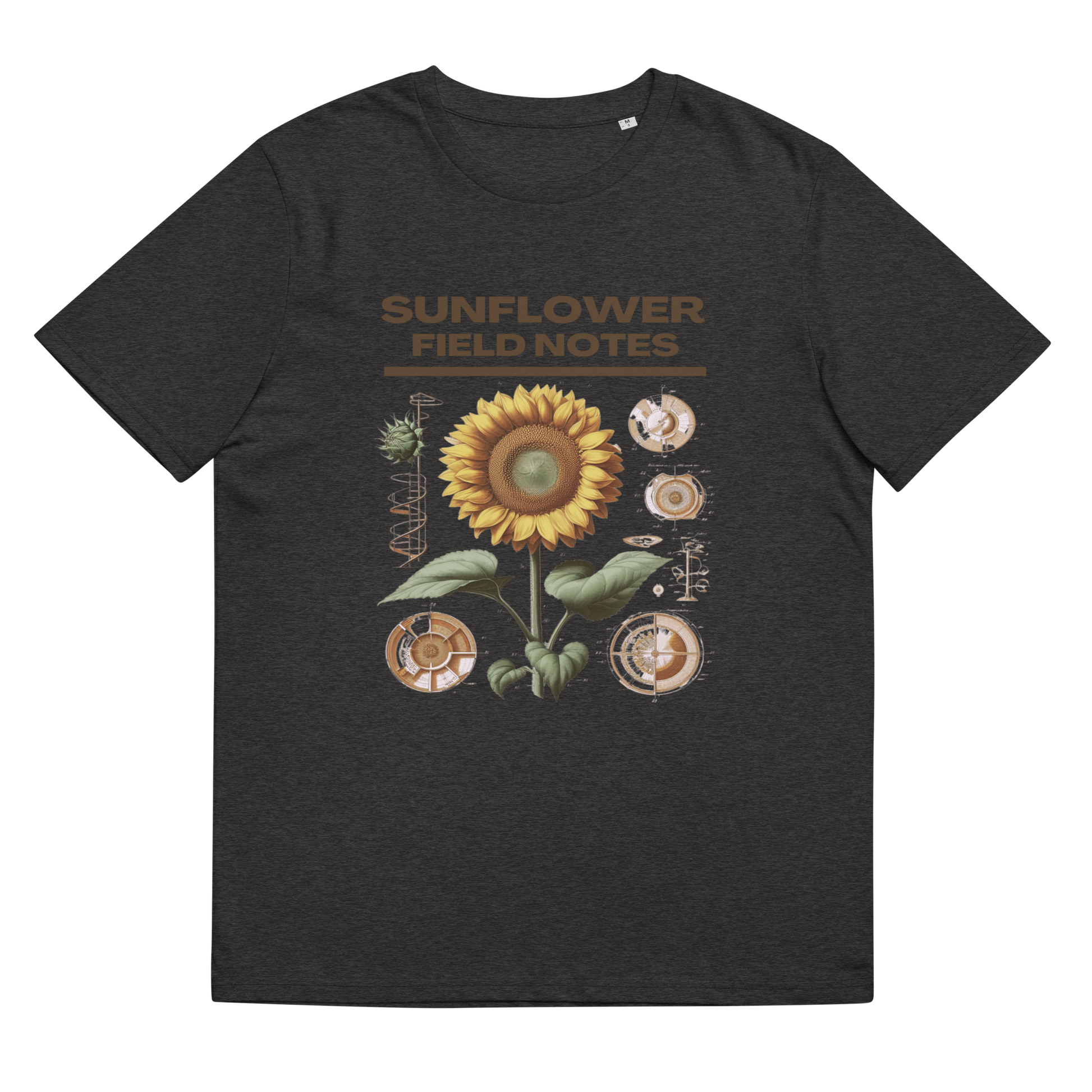 Close-up of the 'Sunflower Field Notes' Tee Shirt in dark heather grey, laid flat to exhibit the sunflower's vibrant details, showcasing an appreciation for botanical art and eco-conscious choices.