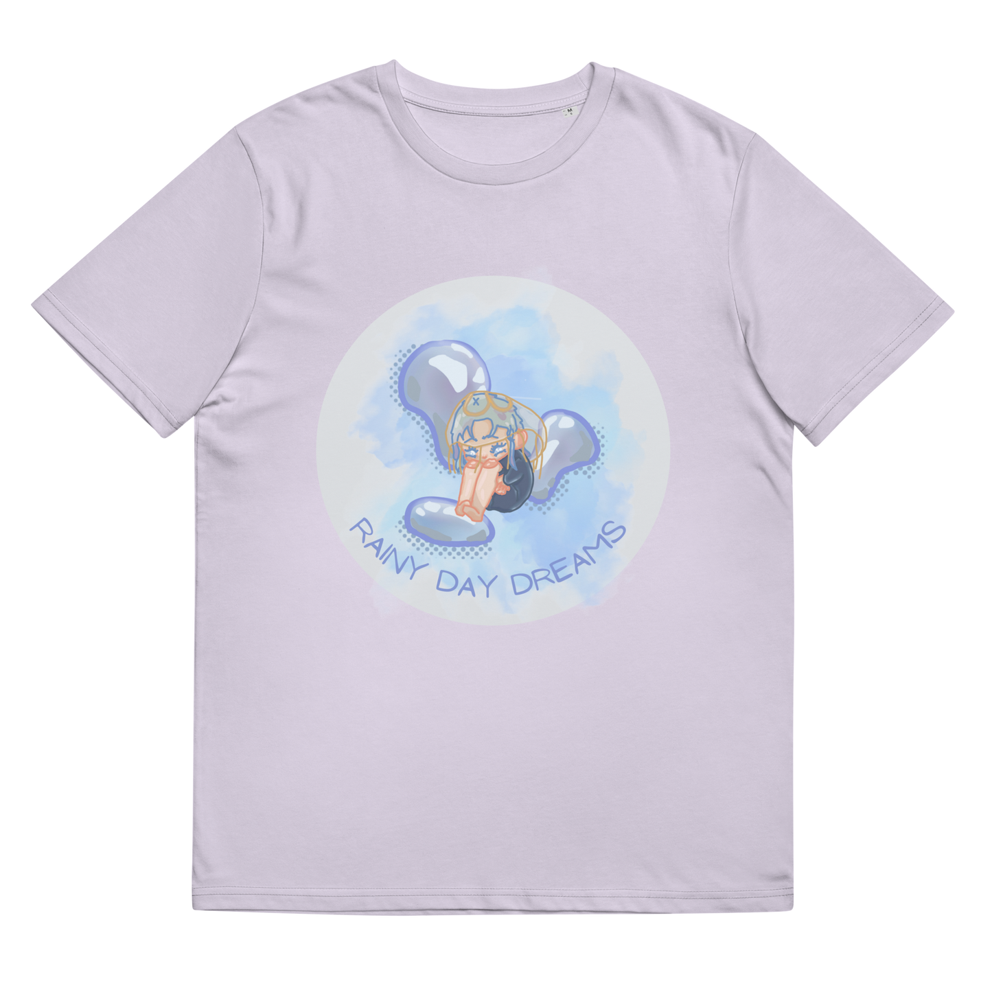 Close-up of the 'Rainy Day Dreams' T-Shirt in Lavender, laid flat to display the emotive chibi character design, coupled with the inspiring 'Rainy Day Dreams' slogan, celebrating the full spectrum of human emotions.