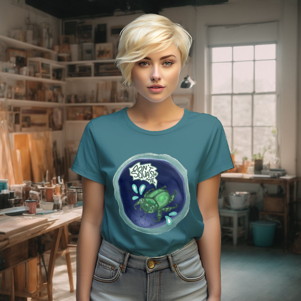 Model wearing the 'Don't Squash Me' T-Shirt in Stargazer color, featuring a unique watercolor beetle design that conveys a playful yet meaningful message about empathy towards all creatures.