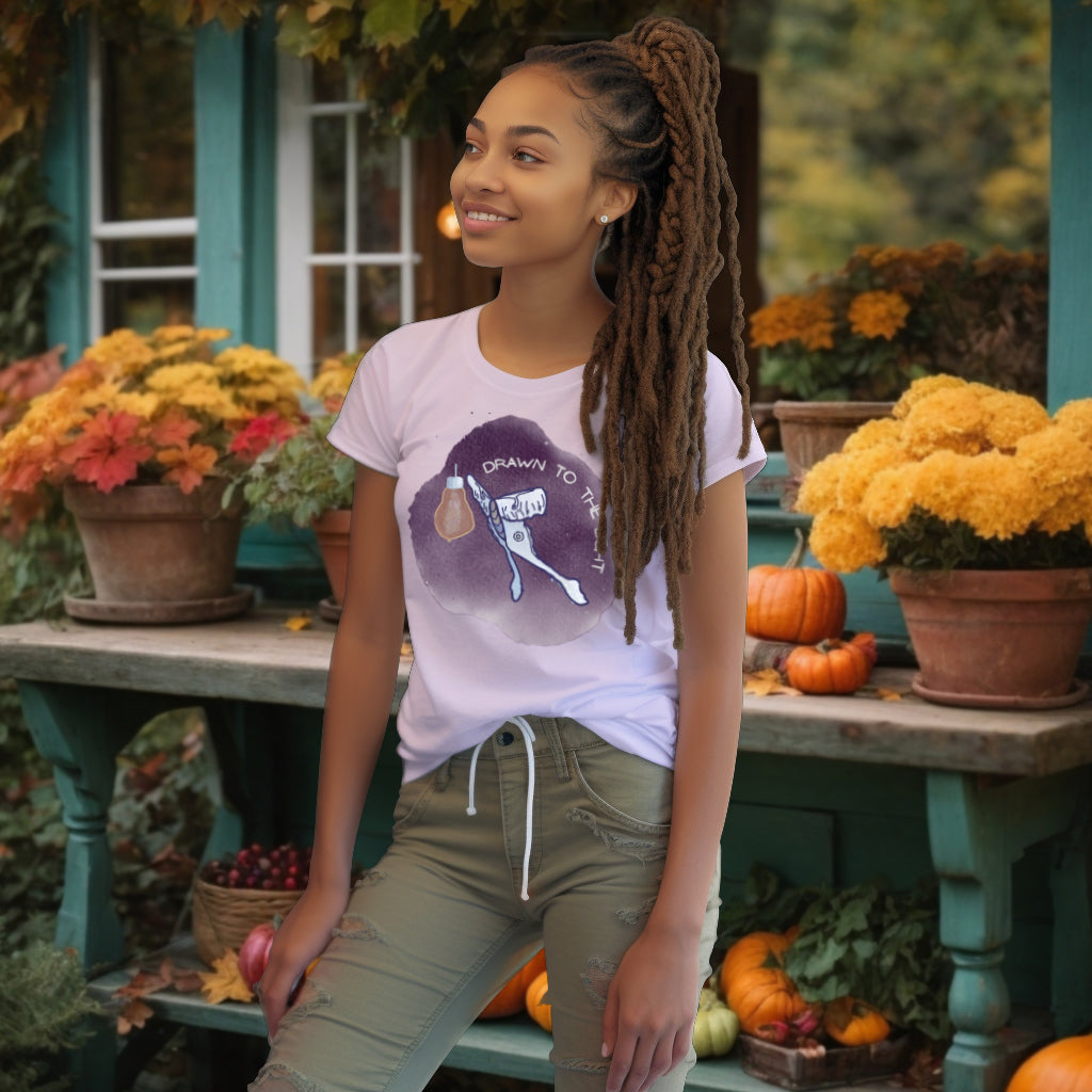 Model displaying the 'Drawn to the Light' T-Shirt in a soft Lavender shade, featuring the serene watercolor design of a Luna Moth attracted to light, epitomizing the search for wisdom.