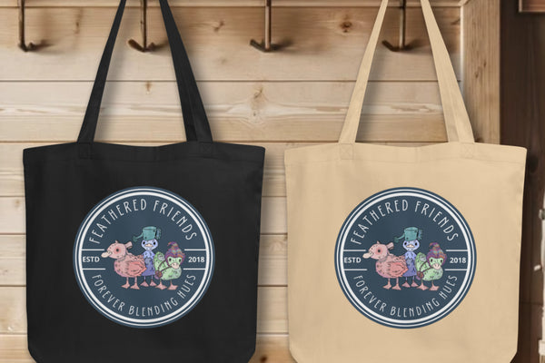 Group display of 'Feathered Friends' Totes in both black and oyster variants, showcasing the whimsical trio of ducklings in vibrant watercolors, symbolizing the beauty of blended hues and enduring friendships.