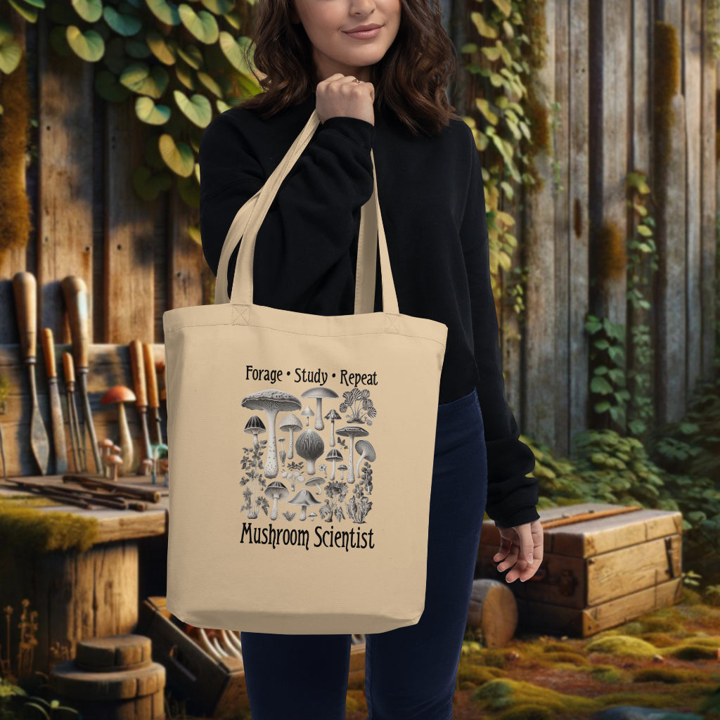 Model showcasing the oyster 'Forage, Study, Repeat' Tote Bag, with its exquisite rendering of mushrooms, evoking the charm of vintage scientific artistry and the pursuit of knowledge.