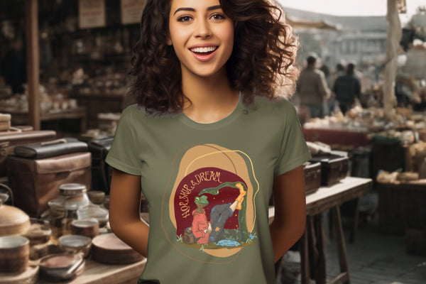 Showcasing the 'Hop, Skip, Dream' T-Shirt in Khaki on a model, highlighting the enchanting frog-human figure in casual attire, inspiring wonder and the pursuit of dreams.
