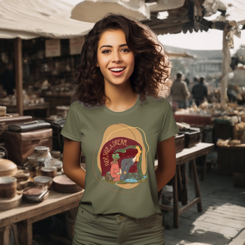 Showcasing the 'Hop, Skip, Dream' T-Shirt in Khaki on a model, highlighting the enchanting frog-human figure in casual attire, inspiring wonder and the pursuit of dreams.