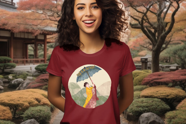 Featuring the 'Magic is in the Heart' T-Shirt in Burgundy on a model, the design captures the grace of traditional Japanese attire and the enchanting landscape, echoing a journey of wonder and empowerment.