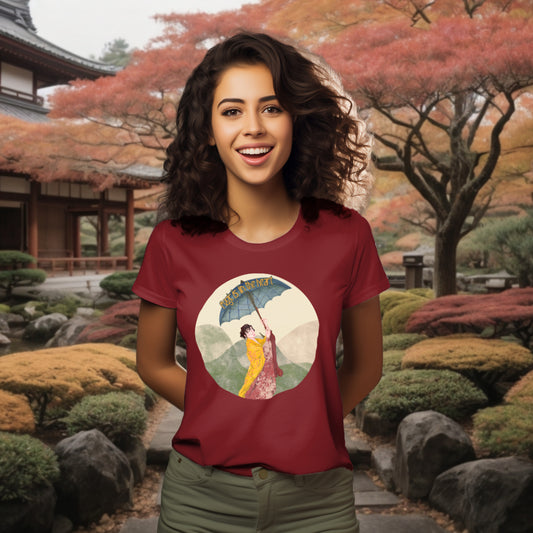 Featuring the 'Magic is in the Heart' T-Shirt in Burgundy on a model, the design captures the grace of traditional Japanese attire and the enchanting landscape, echoing a journey of wonder and empowerment.
