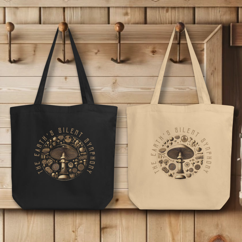 Collection of 'The Earth's Silent Symphony' Tote Bags in black and oyster colors, elegantly displayed, highlighting the artistic and scientific rendition of mushrooms, embodying the wonders of the natural ecosystem.