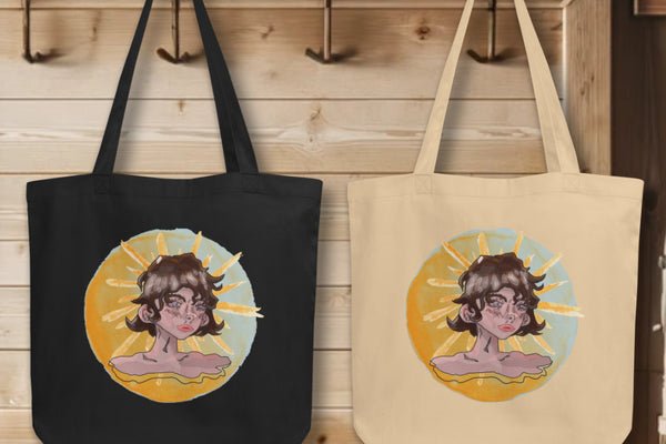 Group display of 'Sunshine Girl' Totes in black and oyster, hanging on wall hooks, each featuring the intriguing watercolor design of a contemplative girl against a sun backdrop, a blend of Art Deco inspiration and modern artistic techniques.