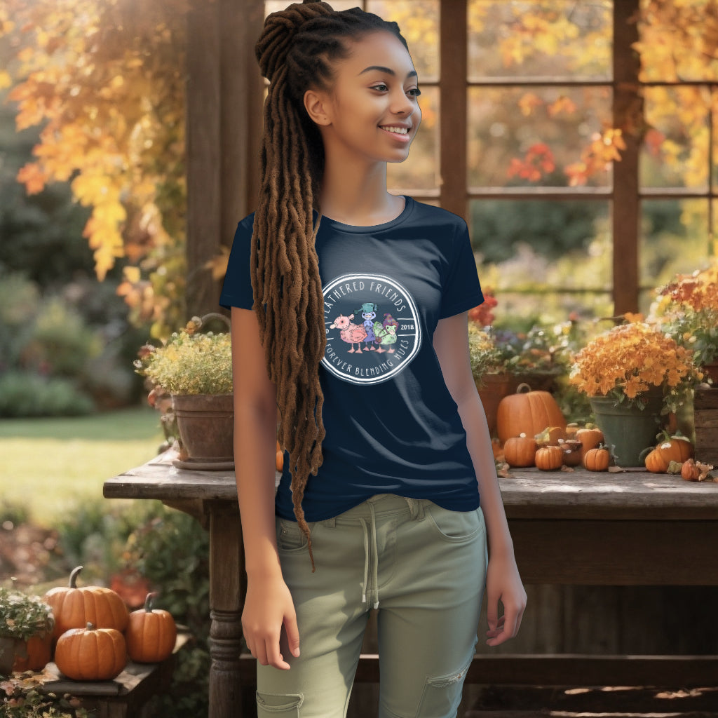 Model showcases the 'Feathered Friends' organic cotton T-Shirt in French Navy, with a trio of ducklings in charming attire, representing the beauty of individuality within friendship.