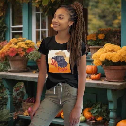 Model sports the 'Yee Caw' T-Shirt in Black, with a crow in a straw hat design, infusing playfulness and a rustic charm into the sustainable fashion choice.