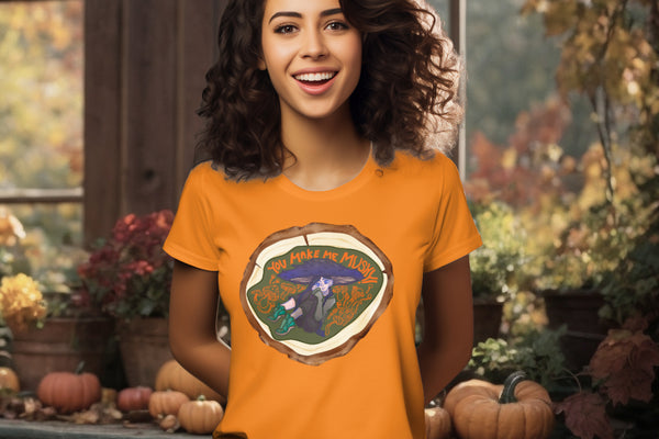 Model wearing the 'You Make Me Mushy' T-Shirt in Day Fall orange, featuring a charming mushroom girl and an assortment of mushrooms, symbolizing nature's whimsy and heartfelt emotions.