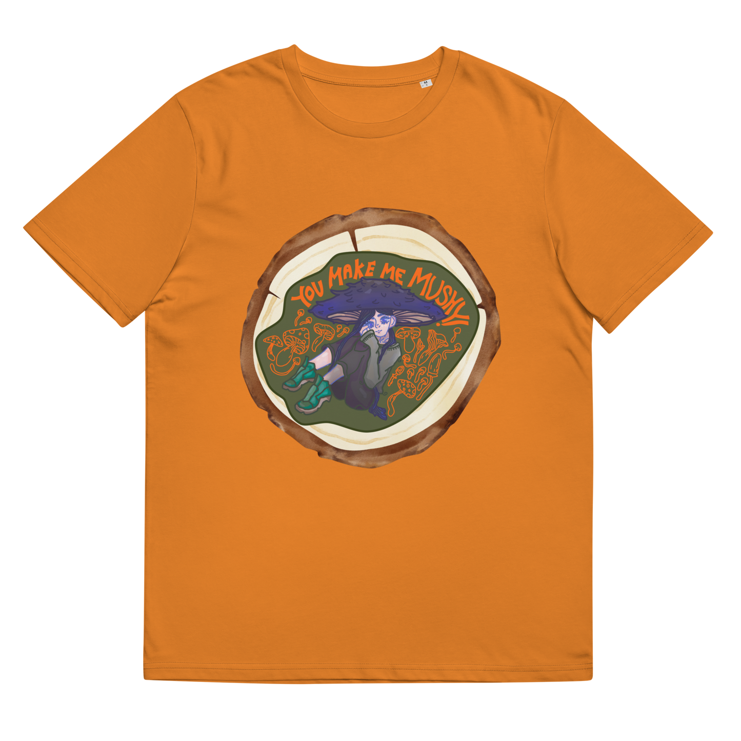 Lay-flat image of the 'You Make Me Mushy' T-Shirt in Day Fall orange, showcasing the enchanting mushroom girl surrounded by nature, a playful expression of love and the beauty of the natural world.